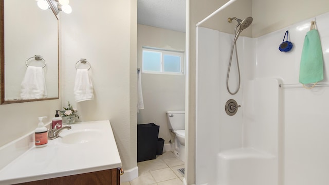 full bath with toilet, a shower, vanity, and tile patterned floors