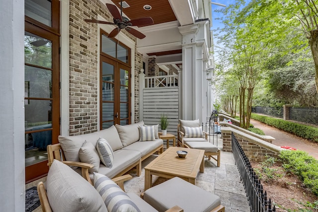 view of patio with outdoor lounge area and a ceiling fan