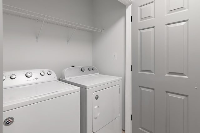 washroom featuring laundry area and independent washer and dryer