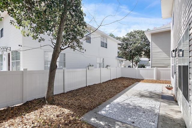 view of yard with a patio area and a fenced backyard