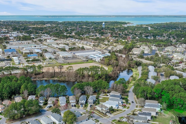 bird's eye view featuring a residential view and a water view