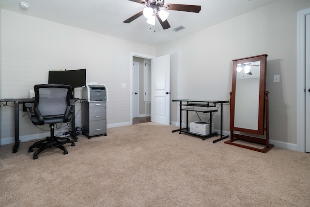 home office featuring carpet floors, visible vents, ceiling fan, and baseboards