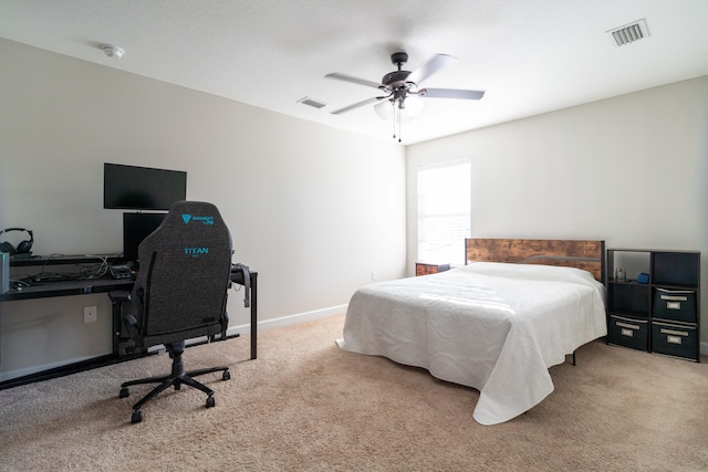 bedroom with a ceiling fan, carpet flooring, visible vents, and baseboards