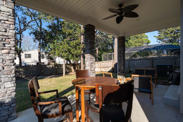 view of patio / terrace featuring ceiling fan, outdoor dining space, and a fenced backyard