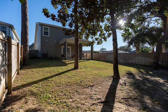 view of yard featuring cooling unit and a fenced backyard