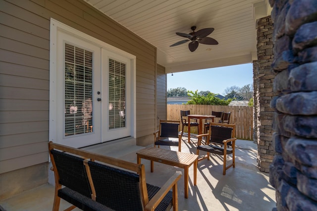 view of patio with outdoor lounge area, ceiling fan, fence, and outdoor dining area