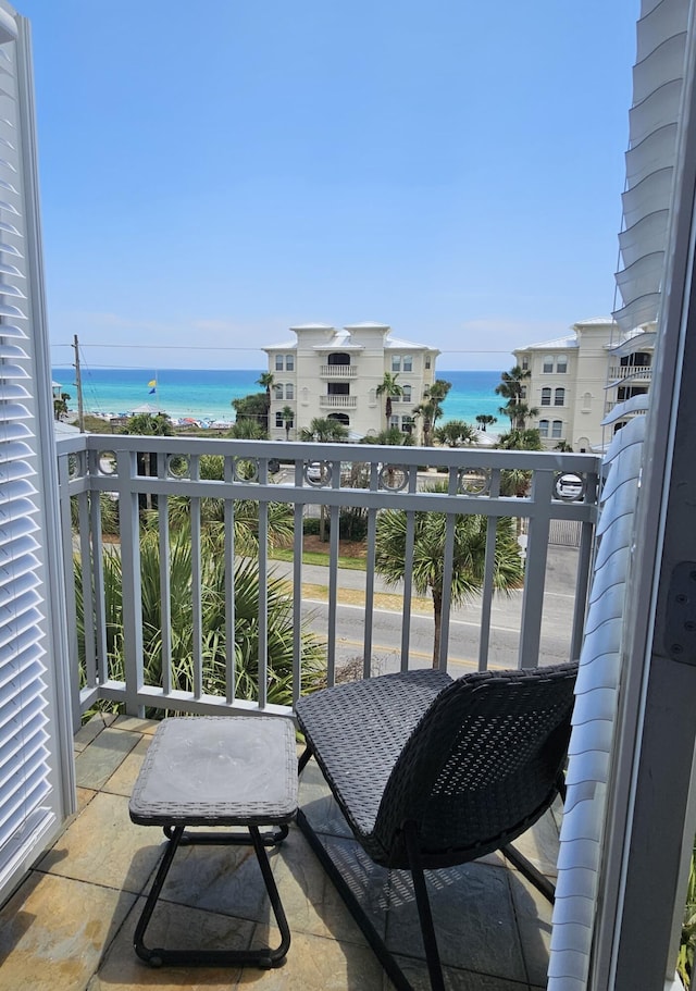 balcony featuring a water view