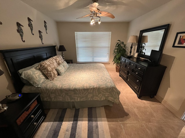 bedroom featuring ceiling fan and light tile patterned flooring