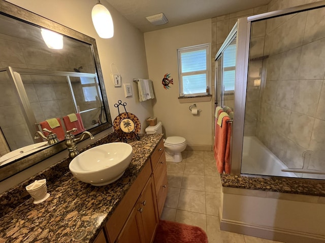 full bathroom with tile patterned flooring, a shower stall, and vanity