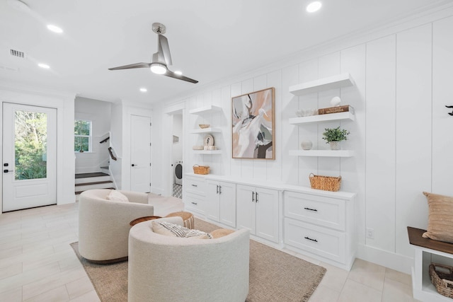 sitting room featuring visible vents, a ceiling fan, stairway, crown molding, and recessed lighting