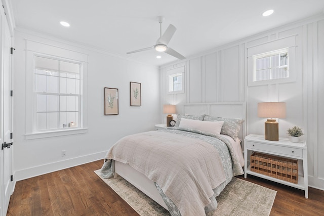 bedroom with recessed lighting, wood finished floors, a ceiling fan, baseboards, and ornamental molding