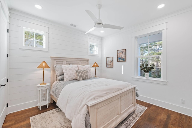 bedroom with baseboards, visible vents, dark wood-type flooring, and recessed lighting