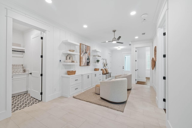 living room with a ceiling fan, crown molding, and recessed lighting