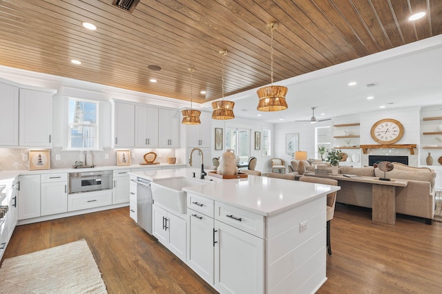 kitchen featuring dishwasher, wooden ceiling, a sink, and dark wood finished floors