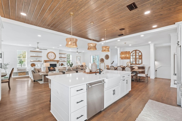 kitchen with wooden ceiling, a sink, a lit fireplace, stainless steel dishwasher, and dark wood finished floors