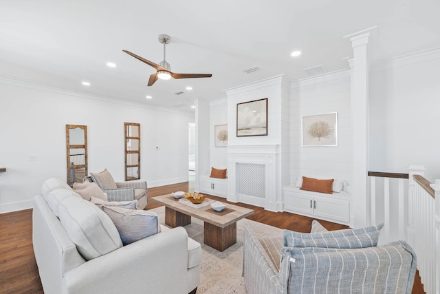 living area with baseboards, ornamental molding, wood finished floors, and recessed lighting