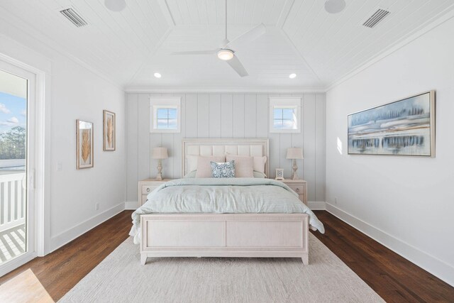 bedroom with access to outside, visible vents, wood finished floors, and ornamental molding