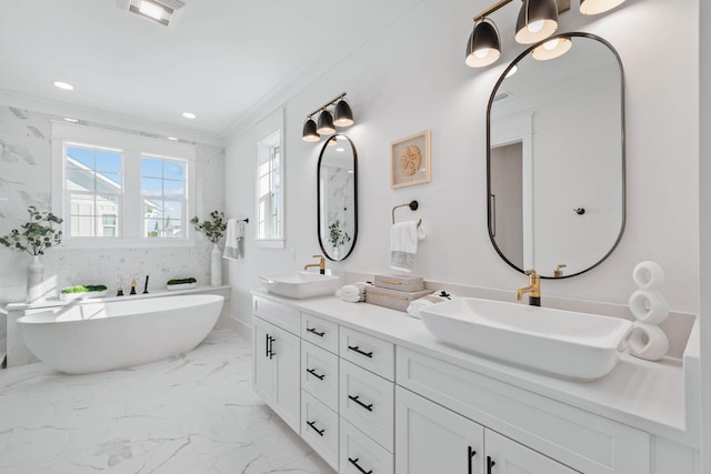 full bath with ornamental molding, marble finish floor, visible vents, and a sink