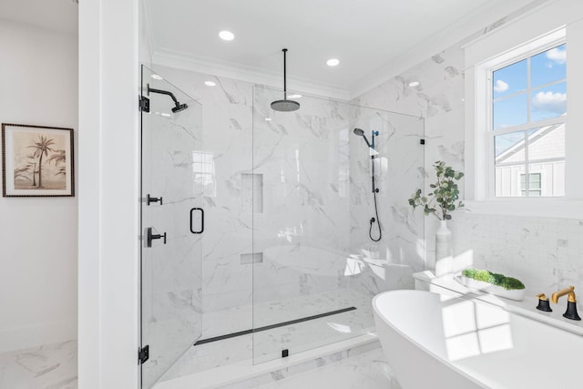 full bathroom with a freestanding tub, recessed lighting, marble finish floor, ornamental molding, and a marble finish shower