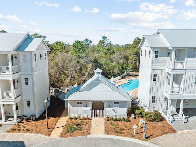 view of building exterior featuring a community pool