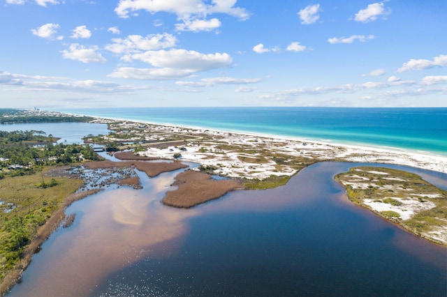 bird's eye view featuring a water view and a beach view