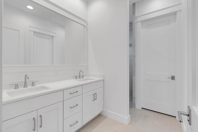 307 W Firethorn Cir Lot 42, Inlet Beach, FL 32461 - bathroom featuring double vanity, baseboards, a sink, and tile patterned floors