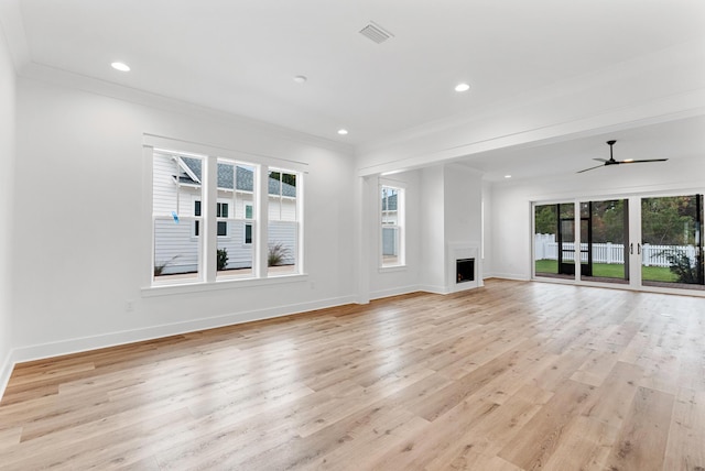 307 W Firethorn Cir Lot 42, Inlet Beach, FL 32461 - unfurnished living room with a wealth of natural light, visible vents, light wood-style flooring, and baseboards