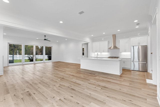 307 W Firethorn Cir Lot 42, Inlet Beach, FL 32461 - kitchen featuring visible vents, ceiling fan, wall chimney exhaust hood, open floor plan, and freestanding refrigerator