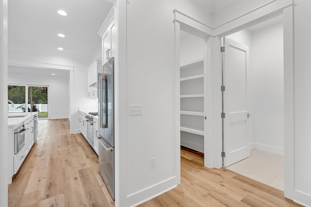 307 W Firethorn Cir Lot 42, Inlet Beach, FL 32461 - kitchen with light countertops, light wood finished floors, oven, recessed lighting, and white cabinetry