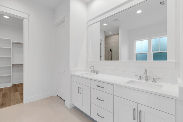 307 W Firethorn Cir Lot 42, Inlet Beach, FL 32461 - bathroom with a shower stall, visible vents, a spacious closet, and a sink