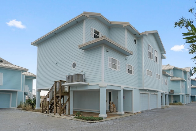 exterior space with a garage and stairway