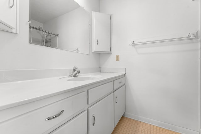 bathroom featuring vanity and baseboards