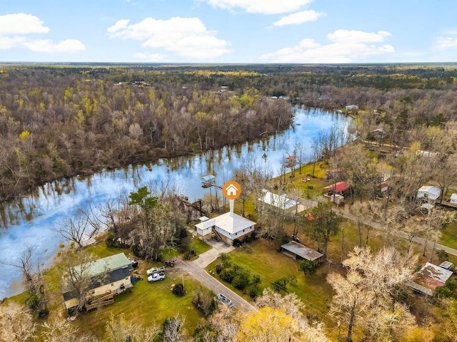 aerial view featuring a water view and a wooded view