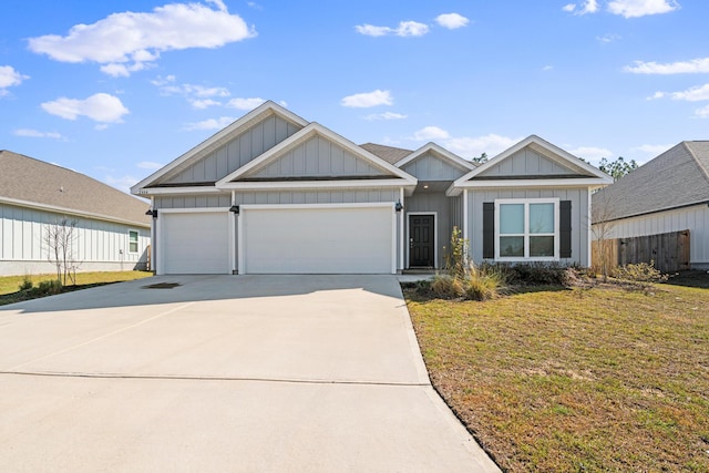 view of front of property featuring an attached garage, a front lawn, board and batten siding, and concrete driveway