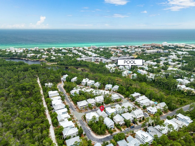 birds eye view of property with a water view and a residential view