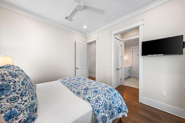 bedroom with recessed lighting, ornamental molding, ceiling fan, wood finished floors, and baseboards