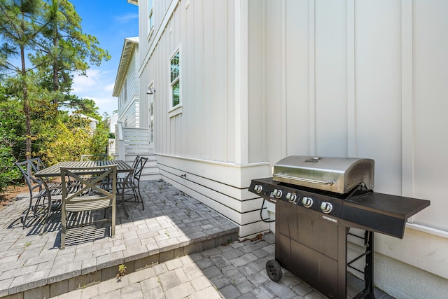 view of patio featuring a grill and outdoor dining space