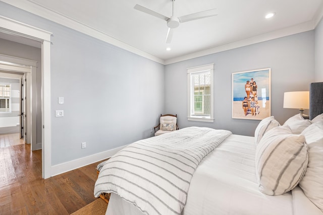 bedroom featuring baseboards, ceiling fan, ornamental molding, wood finished floors, and recessed lighting