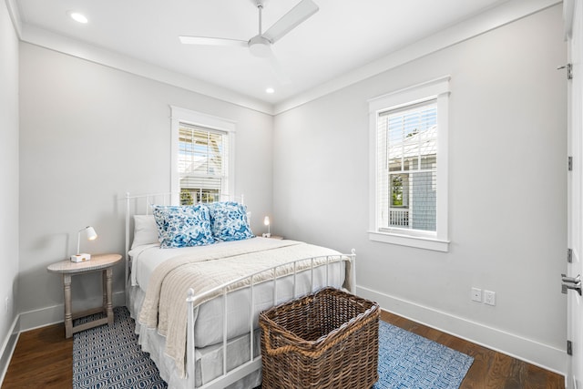 bedroom with recessed lighting, multiple windows, baseboards, and wood finished floors