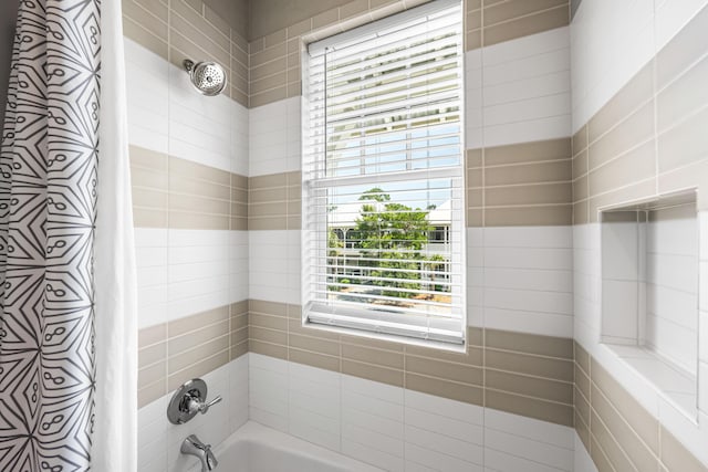 bathroom with shower / bath combo