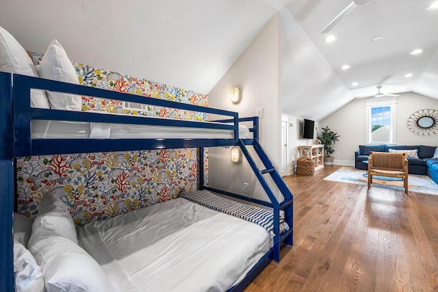 bedroom with recessed lighting, vaulted ceiling, baseboards, and wood finished floors