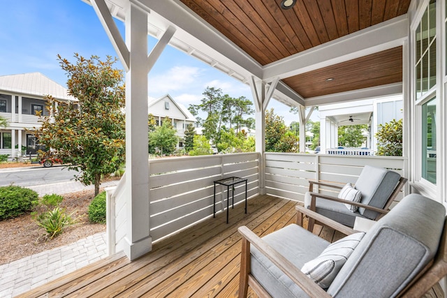 wooden terrace featuring covered porch