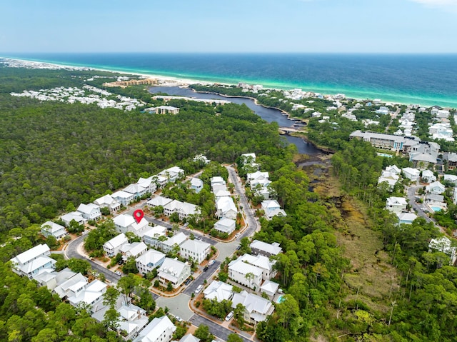 drone / aerial view featuring a water view and a residential view