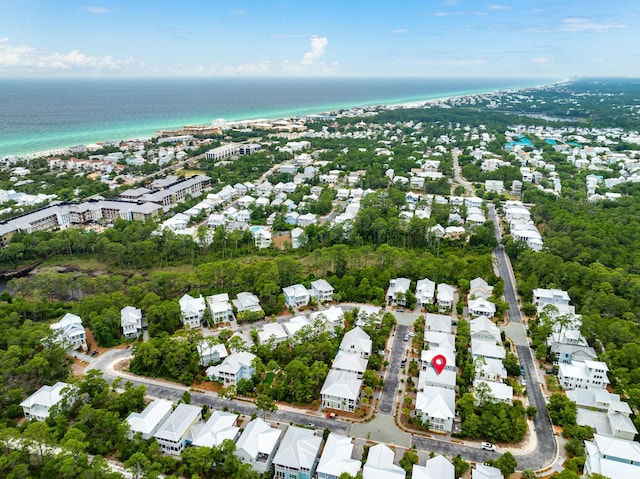 aerial view with a water view, a residential view, and a beach view