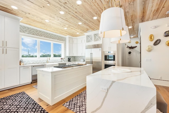 kitchen with a center island, stainless steel appliances, tasteful backsplash, light wood-style floors, and wooden ceiling