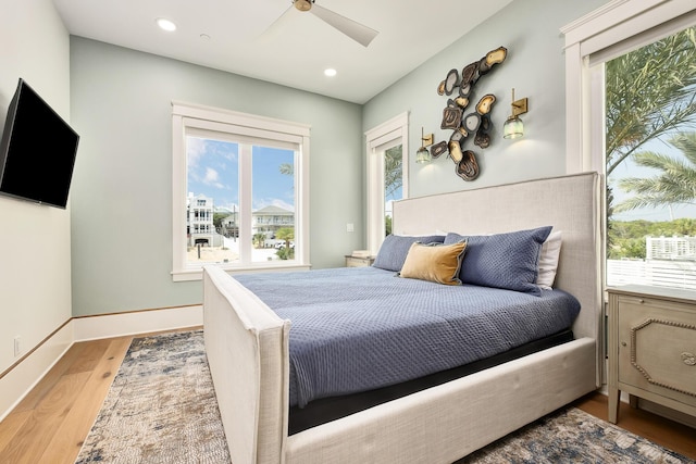 bedroom featuring recessed lighting, wood finished floors, a ceiling fan, and baseboards