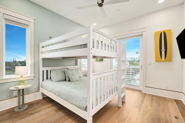 bedroom with recessed lighting, ceiling fan, wood finished floors, access to outside, and baseboards