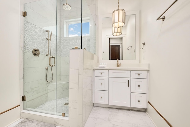 bathroom with marble finish floor, a stall shower, vanity, and baseboards