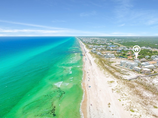 birds eye view of property with a view of the beach and a water view