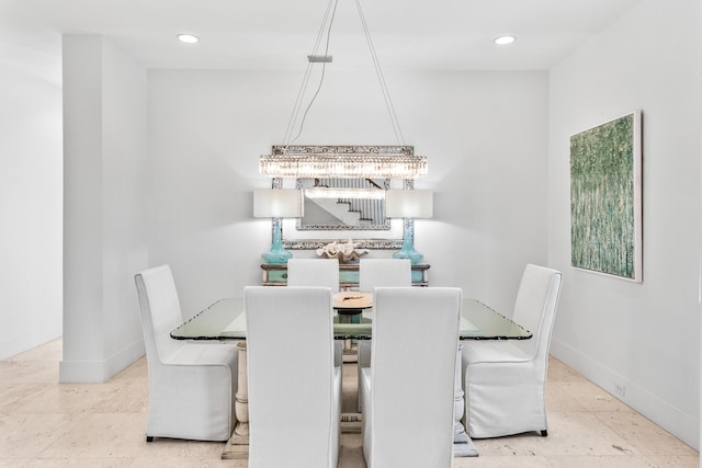 dining area with recessed lighting, an inviting chandelier, and baseboards